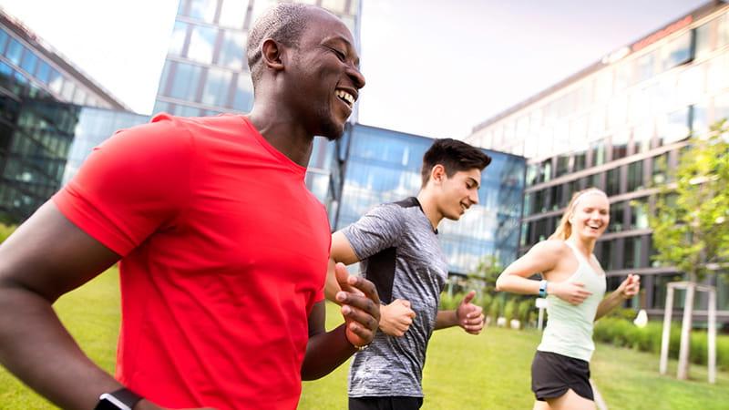 Multi-ethnic friends running or jogging outdoors